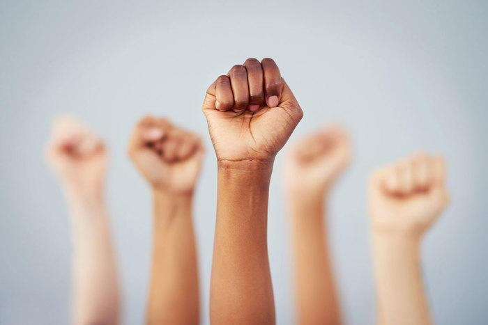 Fists raised in the air