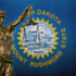 Lady Justice before a South Dakota state flag