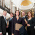 A group of lawyers standing on courthouse stairs